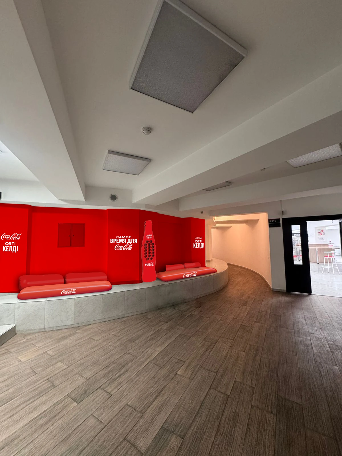 Branded lounge interior with red Coca-Cola furniture